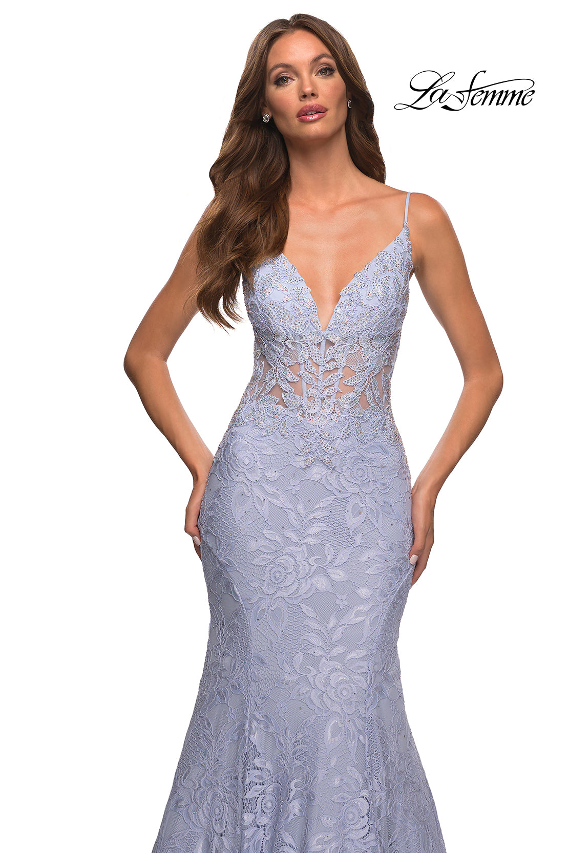 Woman in a fitted lavender La Femme Lace Sheer-Waist Long Mermaid Prom Dress with floral lace, spaghetti straps, and plunging neckline; La Femme logo in the upper right corner.